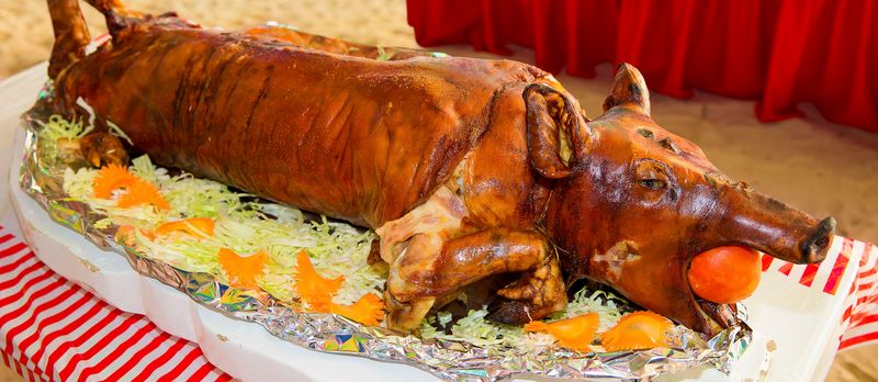 Pork: Slow-Roasted Lechon in the Philippines vs. Cured Prosciutto in Italy
