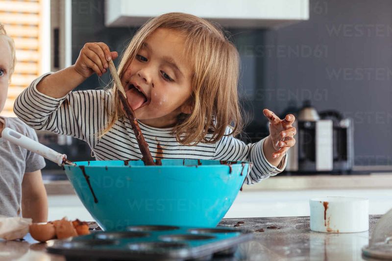 Licking the Spoon After Stirring Cookie Dough