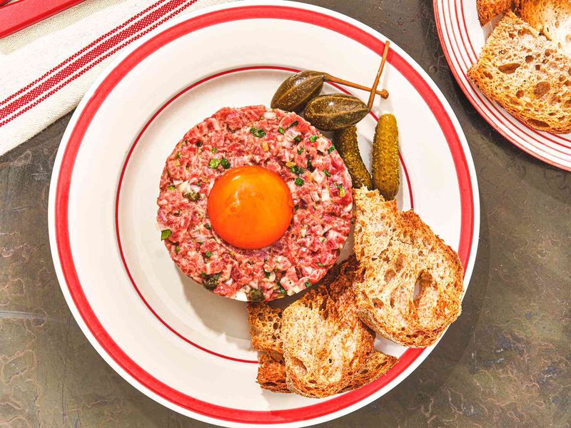 Eating Raw or Undercooked Dishes Like Sashimi or Steak Tartare