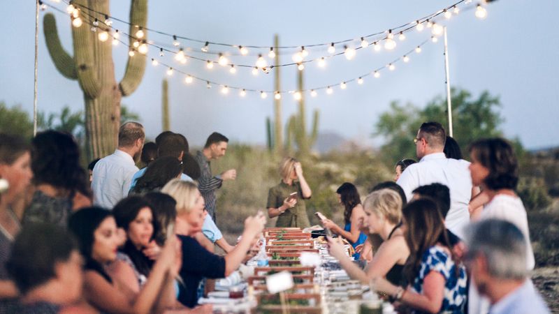Breaking Bread With Strangers at a Long Table Dinner