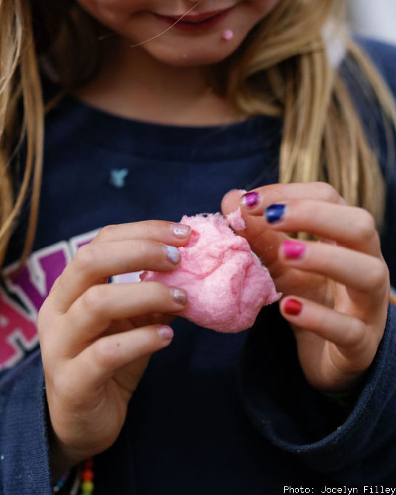Pulling Apart Fresh, Warm Cotton Candy at a Fair